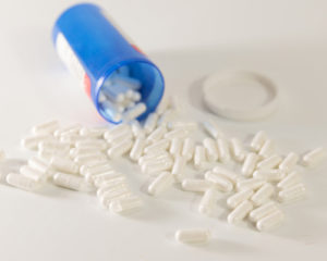 https://serenityatsummit.com/wp-content/uploads/2021/04/blue-pill-bottle-spilling-white-capsules-on-white-background-1-300x240.jpg