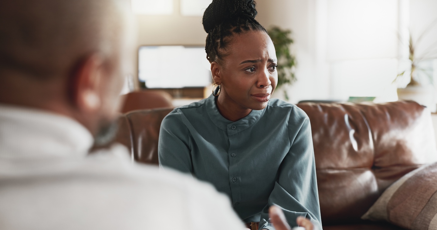 Woman talking to a mental health therapist about grief and loss.